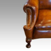 Pair of Edwardian leather wing chairs arm