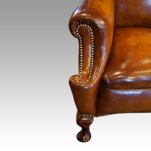 Pair of Edwardian leather wing chairs arm