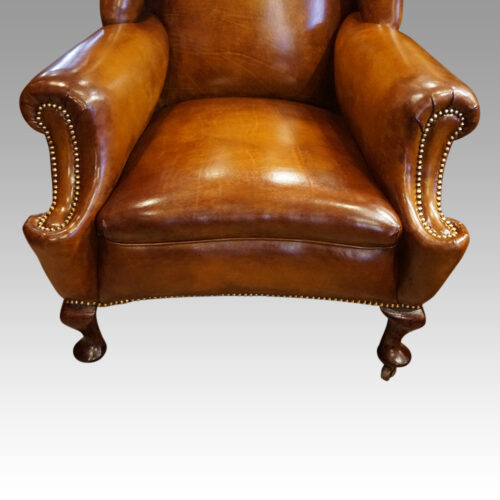 Pair of Edwardian leather wing chairs front seat