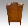 Pair of Edwardian leather wing chairs rear