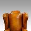 Pair of Edwardian leather wing chairs wings
