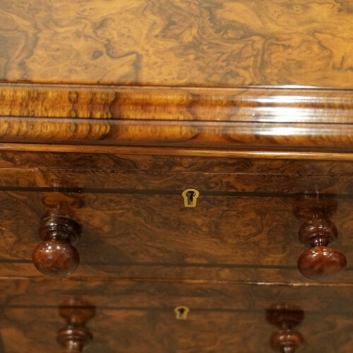 Pair of burr walnut bedside chests top mould