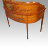 Edwardian satinwood decorated Carlton House desk at angle