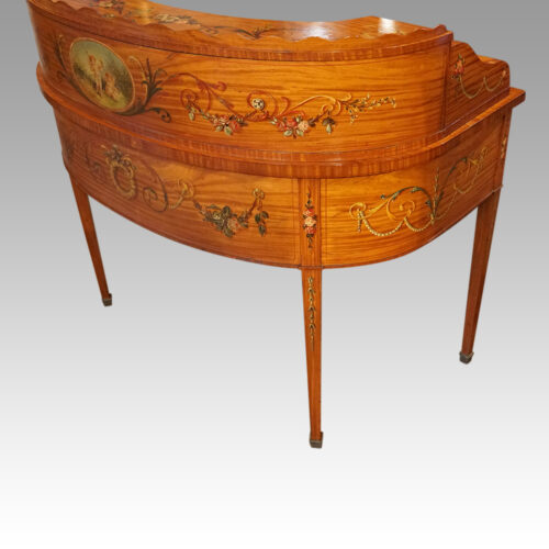Edwardian satinwood decorated Carlton House desk at angle