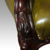 Victorian button back leather easy chair leaf carving
