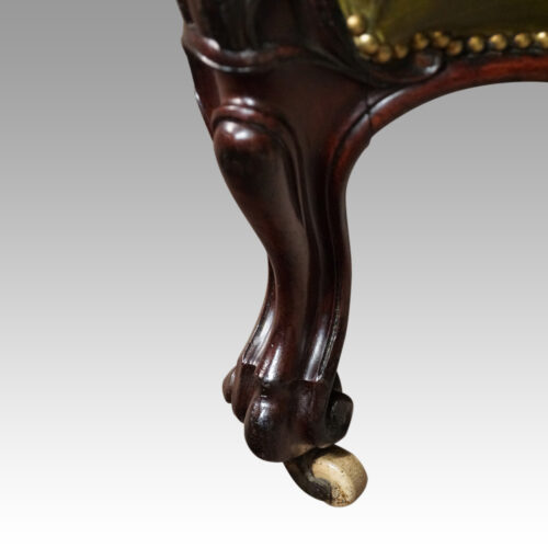 Victorian button back leather easy chair leg detail