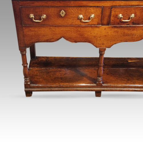 Antique dresser base with pot board shaped arch