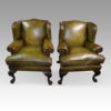Antique Irish green leather wingchairs
