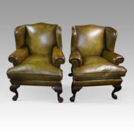 Antique Irish green leather wingchairs