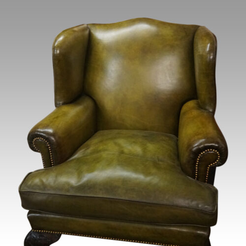 Antique Irish green leather wingchairs cushion