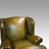 Antique Irish green leather wingchairs inside wing view