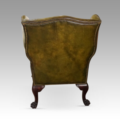 Antique Irish green leather wingchairs rear