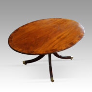 Oval mahogany Regency style dining table angle view
