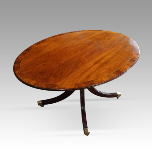Oval mahogany Regency style dining table angle view