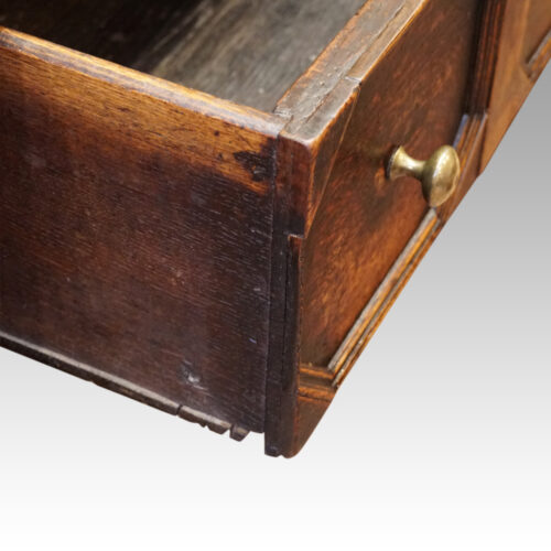 Antique oak long dresser base drawer detail