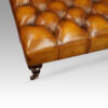 Large deep buttoned leather stool detail