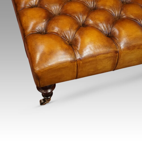 Large deep buttoned leather stool detail