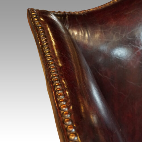 Leather wing chair brass studs