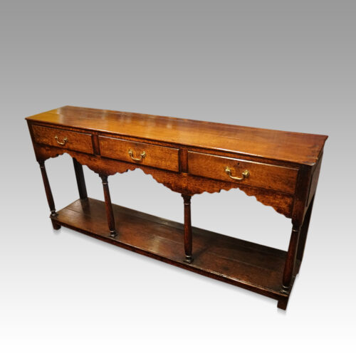 Antique oak turned leg dresser base front angle