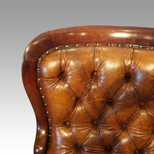 Antique reclining library chair back rail