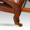 Antique reclining library chair front leg