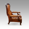 Antique reclining library chair side