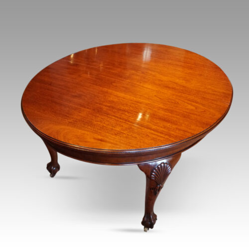 Edwardian mahogany extending dining table at angle
