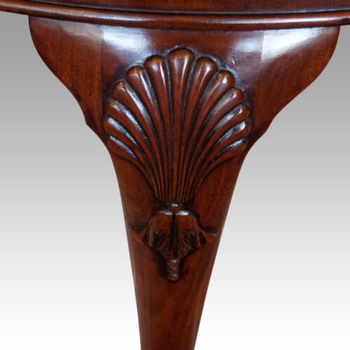 Edwardian mahogany extending dining table shell carved knee