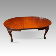 Edwardian mahogany extending dining table with one leaf