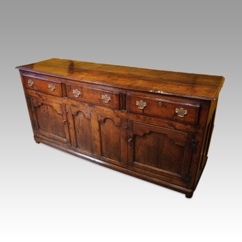 Antique oak cupboard dresser base at angle