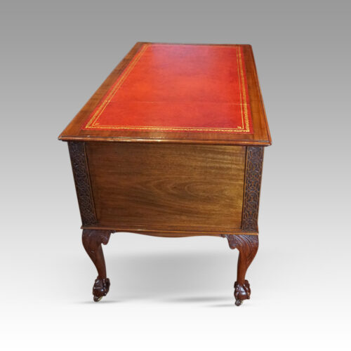 Edwardian Chippendale mahogany desk end view