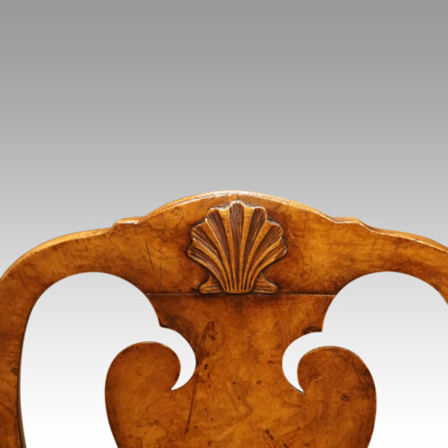 Pair of George I walnut side chairs crest