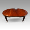Edwardian circular extending dining table one leaf