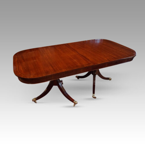 George VI mahogany extending pillar table angled