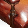 Victorian red leather easy chair arm support