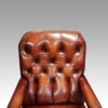 Victorian red leather easy chair button back