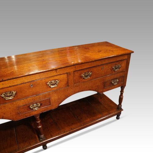Antique oak pot board dresser at angle