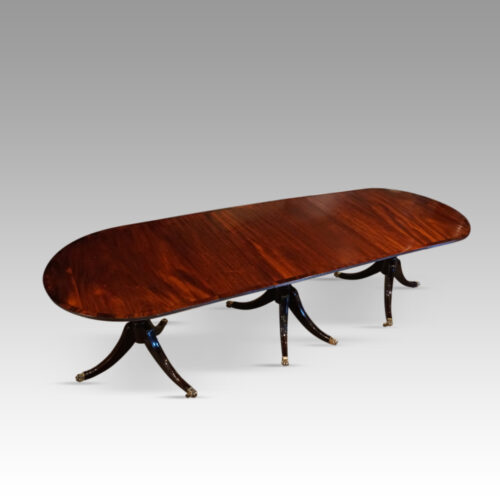 Regency style mahogany small triple pillar table