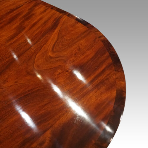 Regency style mahogany small triple pillar table cross banding