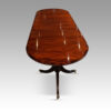 Regency style mahogany small triple pillar table end view