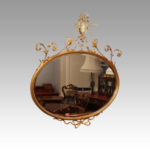 Antique gilt mirror with Wedgwood plaque angle view