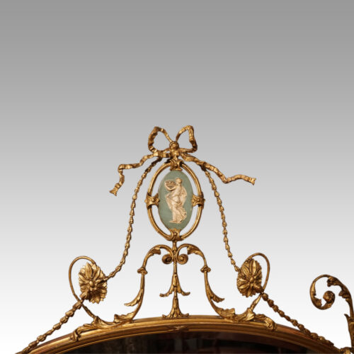 Antique gilt mirror with Wedgwood plaque crest