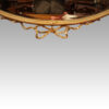 Antique gilt mirror with Wedgwood plaque ribbon