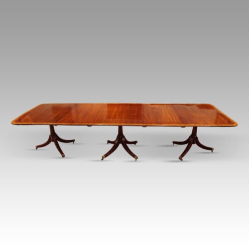 George V mahogany triple pillar dining table