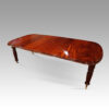Victorian mahogany extending dining table at angle