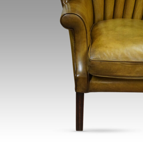 19thc. barrel back wing chair front leg