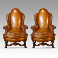 Pair of walnut leather wing chairs