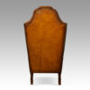 Pair of walnut leather wing chairs rear