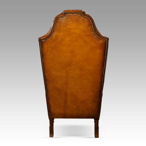 Pair of walnut leather wing chairs rear