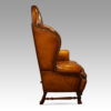 Pair of walnut leather wing chairs side